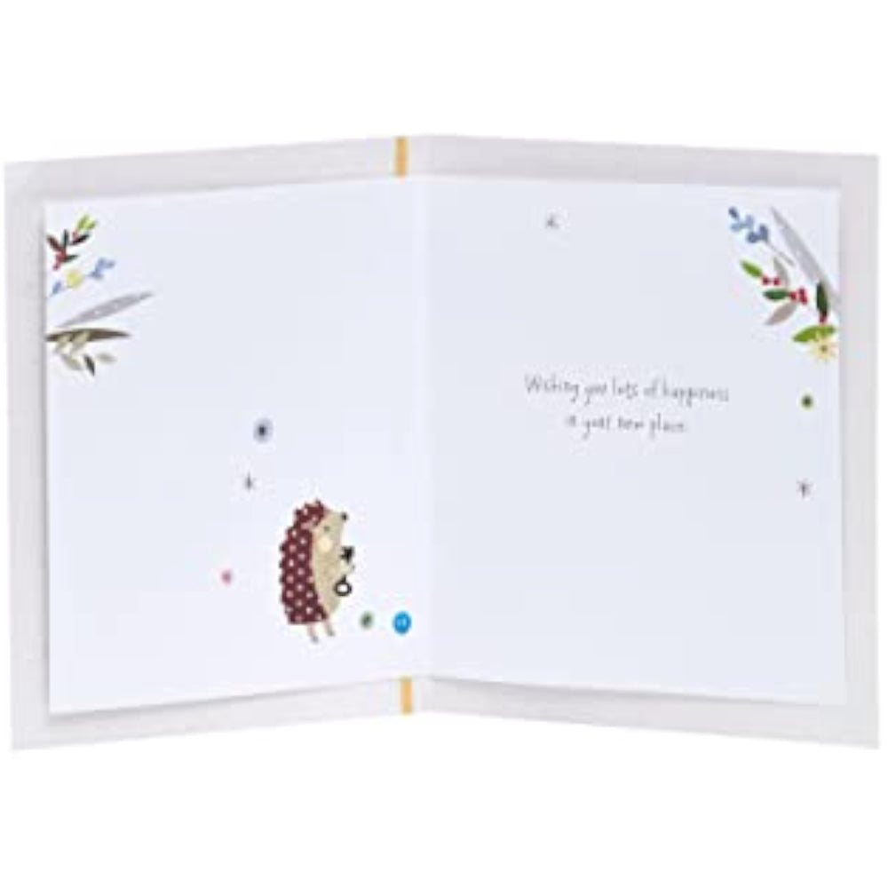 UK Greetings new home greeting card for him, her, or friends featuring a cute hedgehog design with envelope.