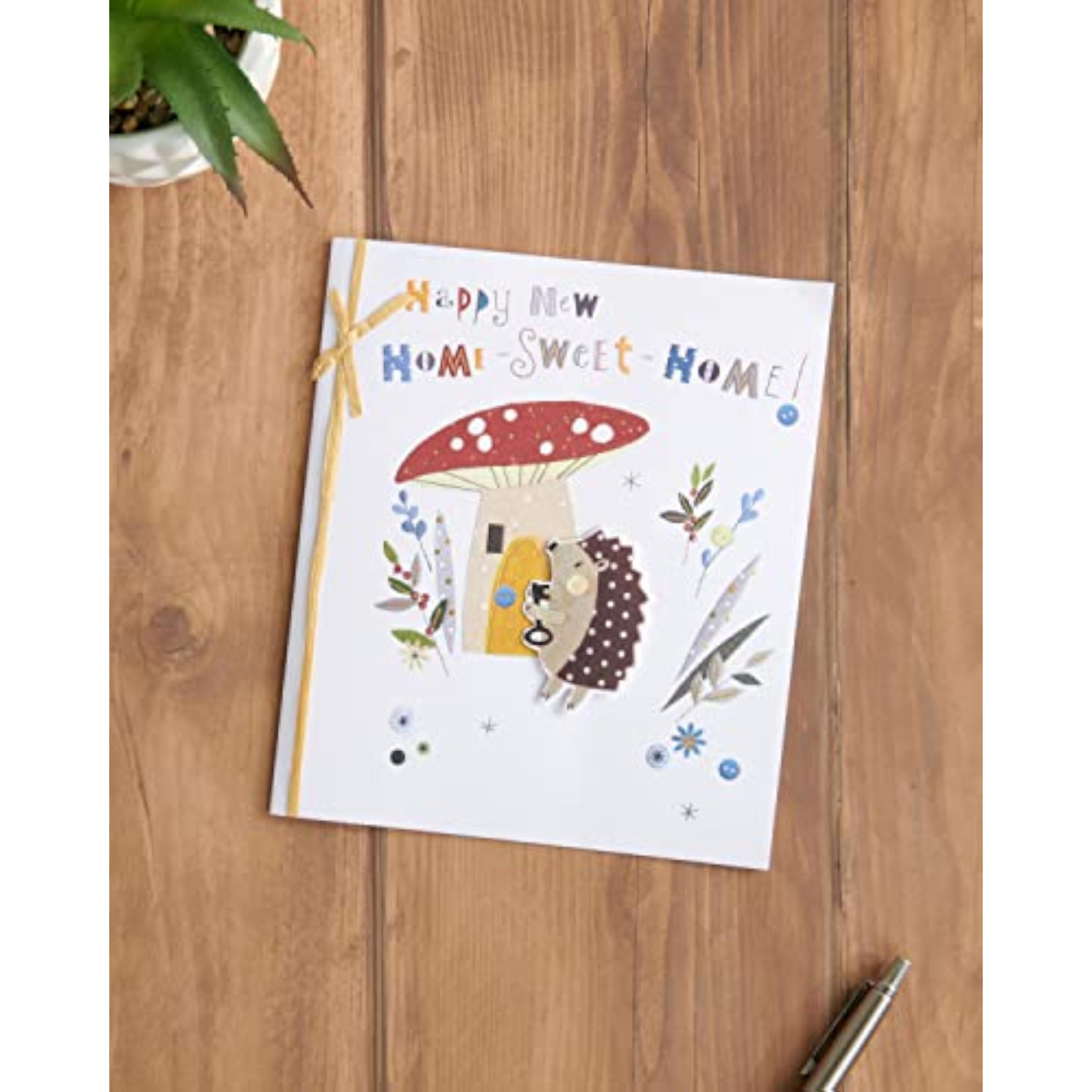 UK Greetings new home greeting card for him, her, or friend featuring a cute hedgehog design with an envelope.