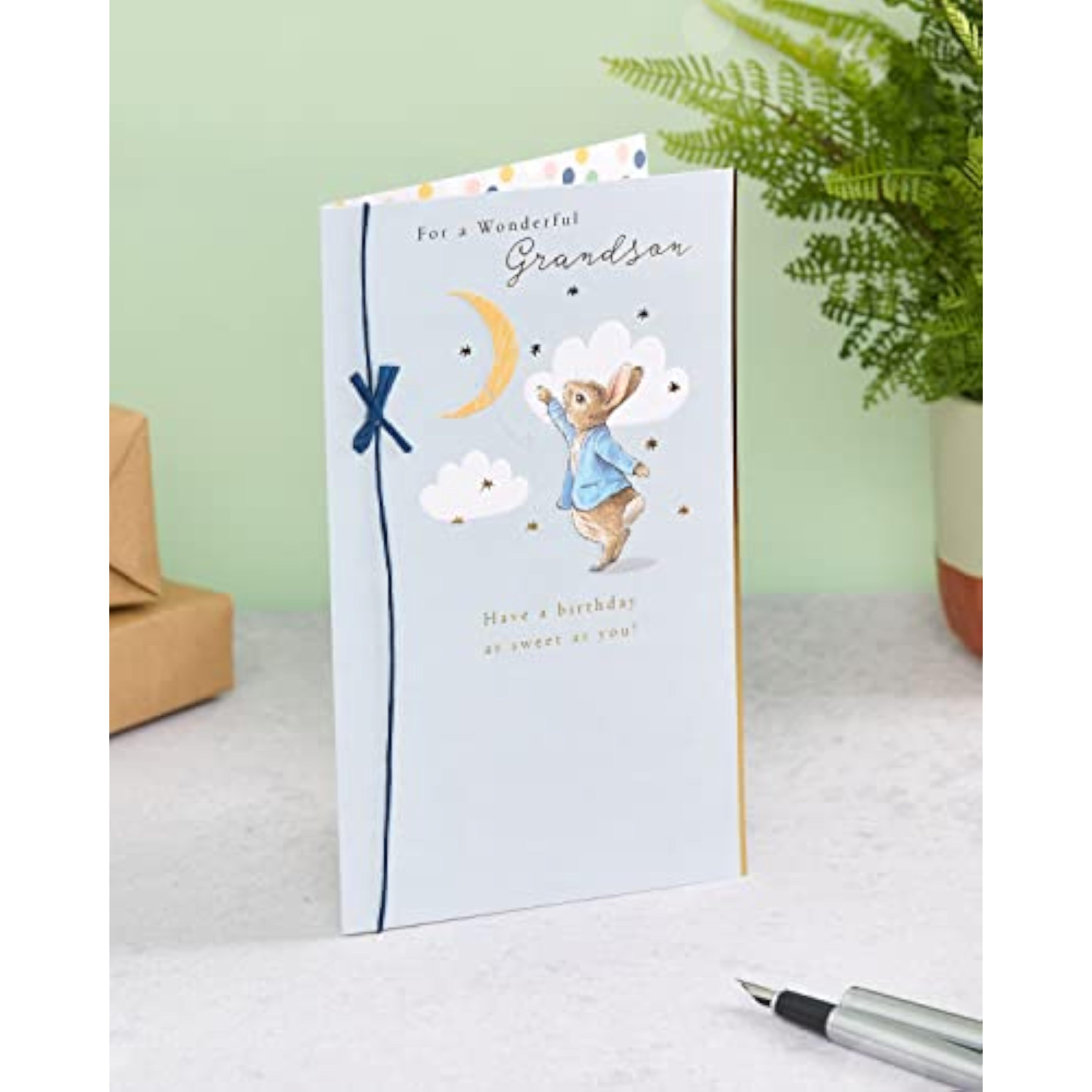 UK Greetings Peter Rabbit birthday card for grandson featuring a charming blue design, perfect for celebrating special occasions.