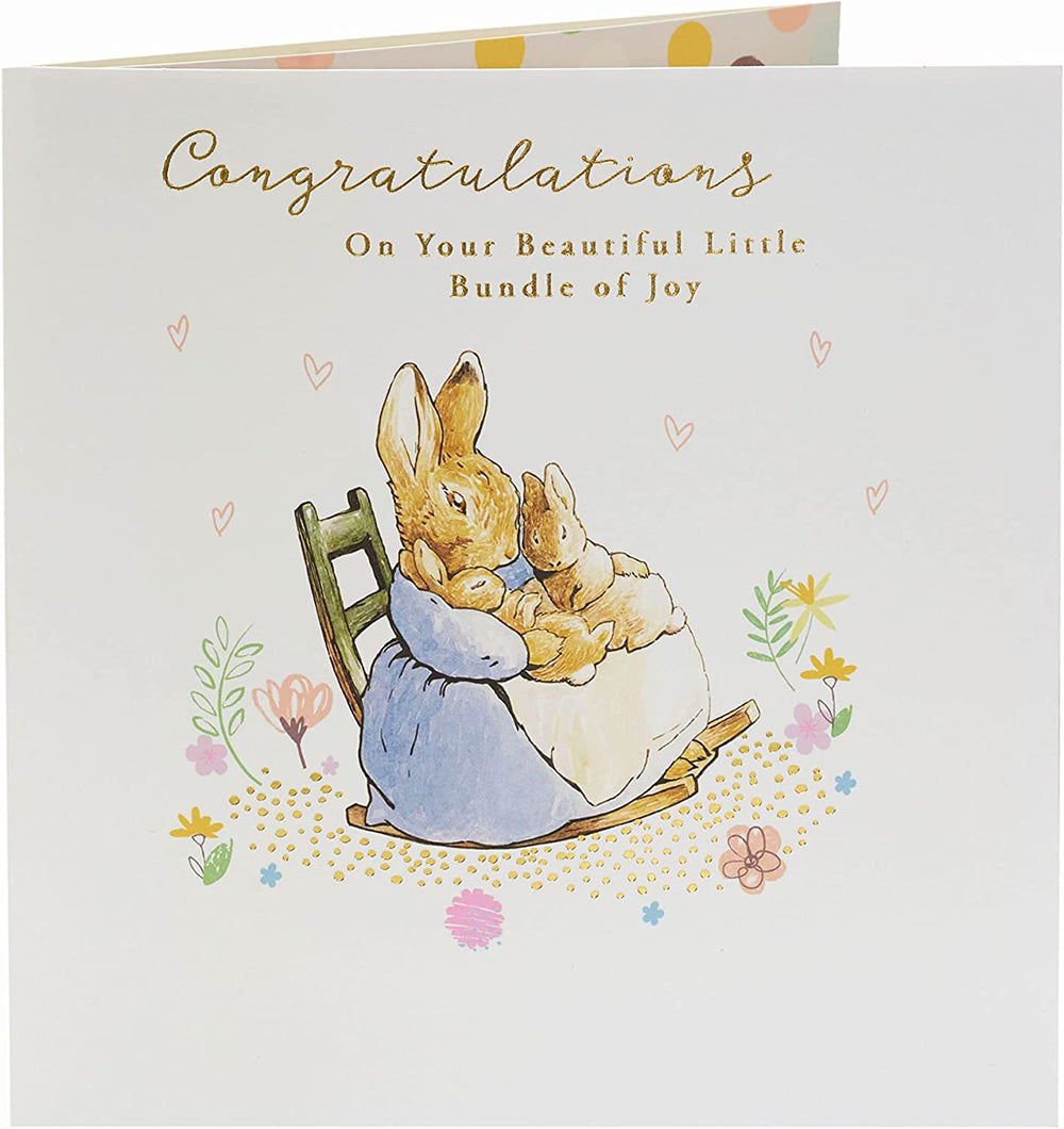 UK Greetings Peter Rabbit new baby congratulations card featuring a colorful illustration of Peter Rabbit and floral accents.