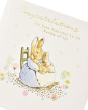 UK Greetings Peter Rabbit new baby congratulations card showing a colorful illustration of Peter Rabbit with floral accents.