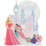 UK Greetings pop-up castle birthday card featuring Aurora, Cinderella, Jasmine, and Ariel with colorful castle design.