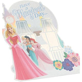 UK Greetings pop-up castle birthday card featuring Aurora, Cinderella, Jasmine, and Ariel with colorful castle design.