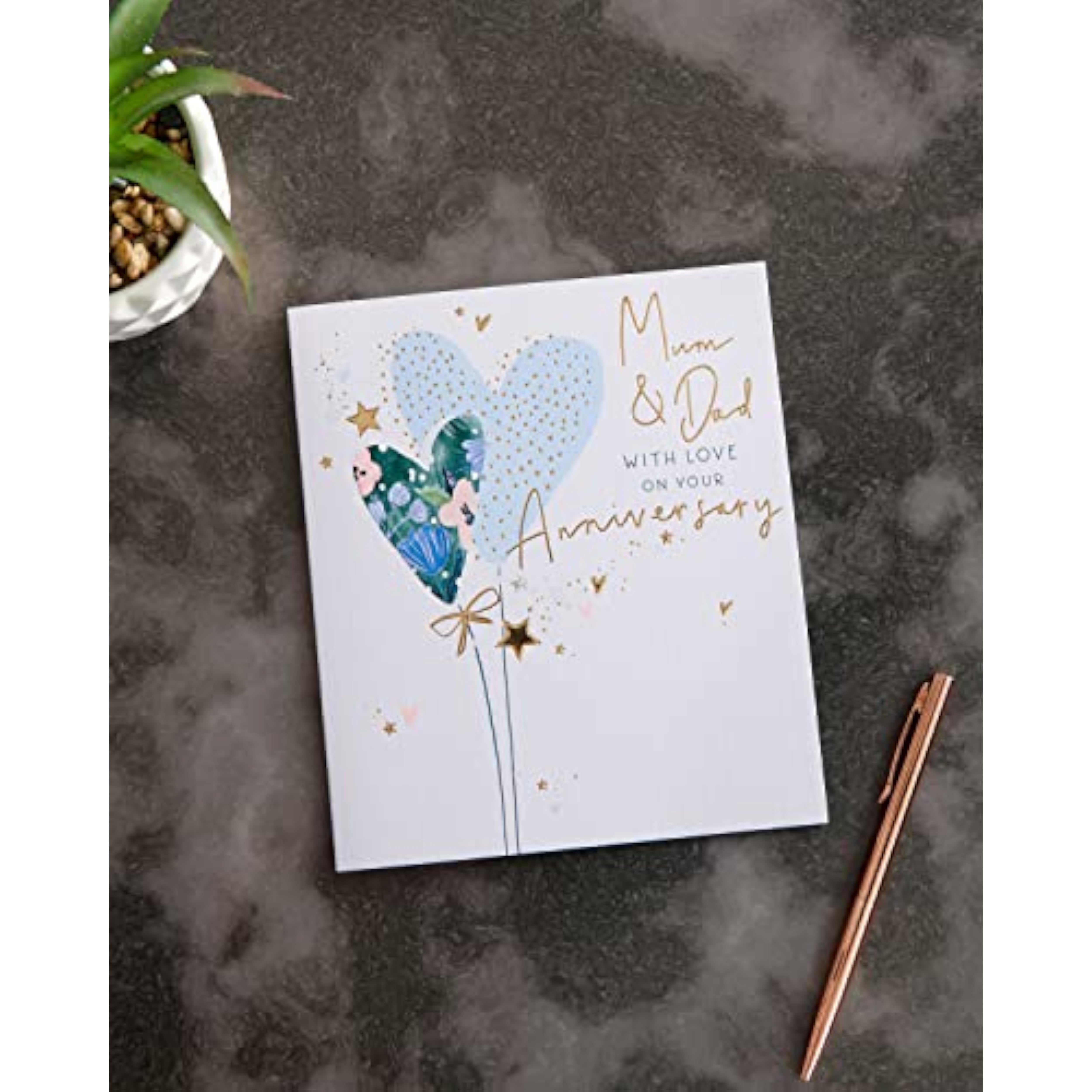 UK Greetings Pretty Hearts Design anniversary greeting card for Mum and Dad, featuring colorful heart illustrations.
