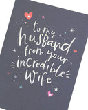 UK Greetings silver foil lettering husband birthday greeting card with elegant design and festive message.