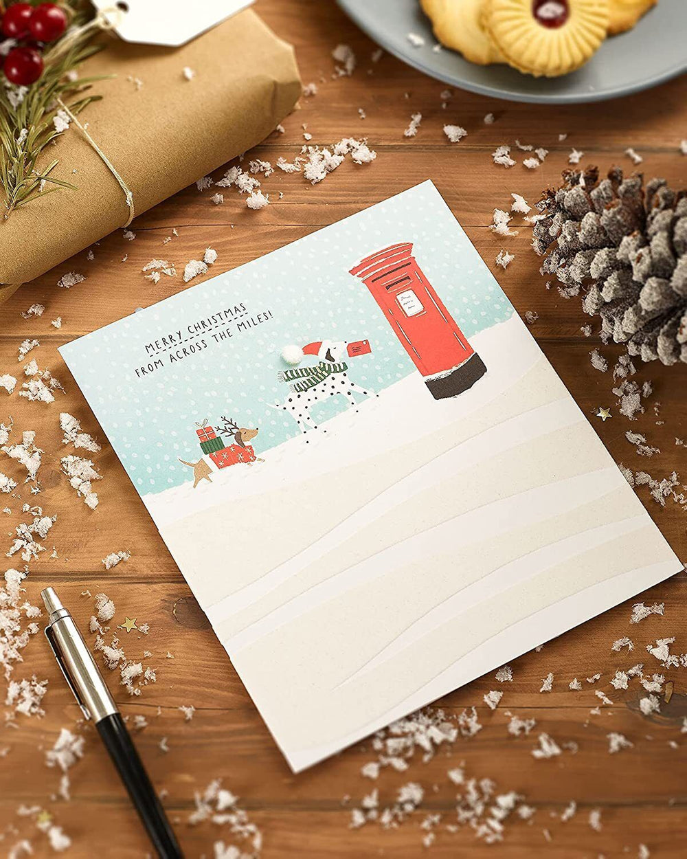 UK Greetings Snow Dogs Christmas Card featuring festive snow dogs design, perfect for holiday greeting cards.