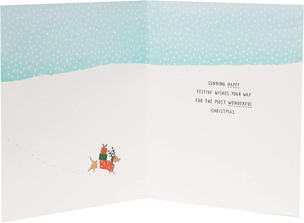 UK Greetings Snow Dogs Christmas Card featuring festive snow dogs design, perfect for holiday greetings and seasonal cheer.