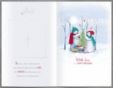 UK Greetings Christmas greeting card featuring snowmen decorating a tree for daughter and son-in-law, festive holiday scene.