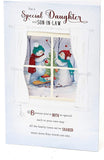 UK Greetings Christmas greeting card featuring snowmen decorating a tree, suitable for daughter and son-in-law.
