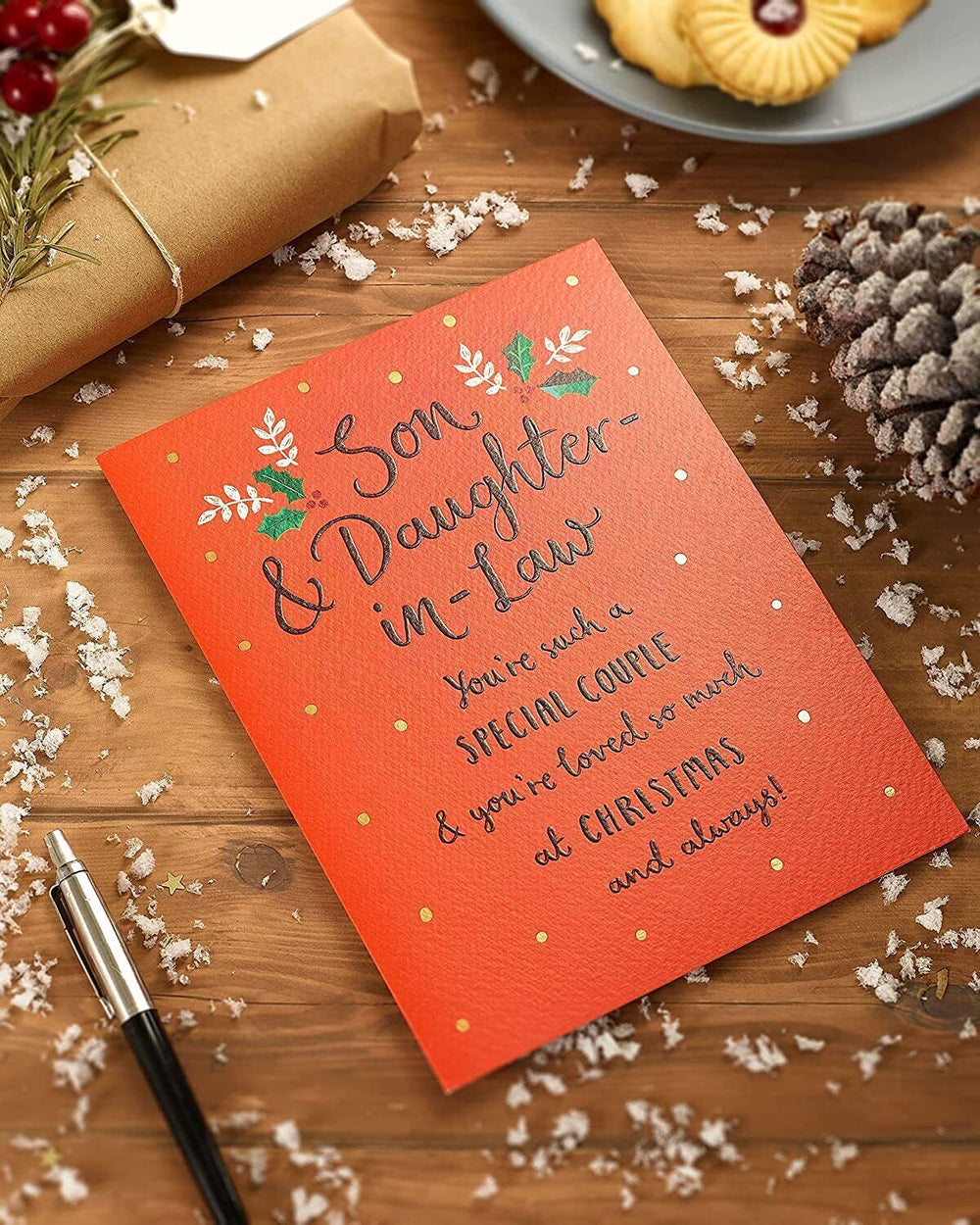 UK Greetings Son & Daughter-in-Law Christmas Card featuring typography design, perfect for holiday greetings to family.