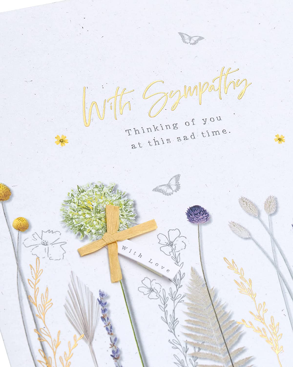 UK Greetings sympathy card with natural floral design, expressing condolences for loss and thinking of you.