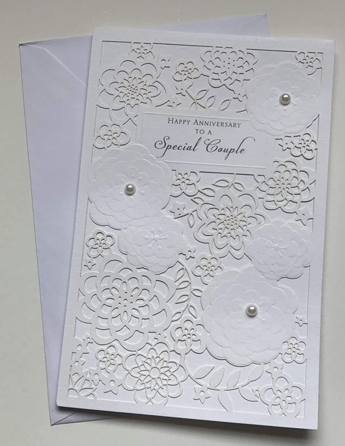 UK Greetings special couple die-cut luxury anniversary greeting card with pearls, celebrating love and congratulations.