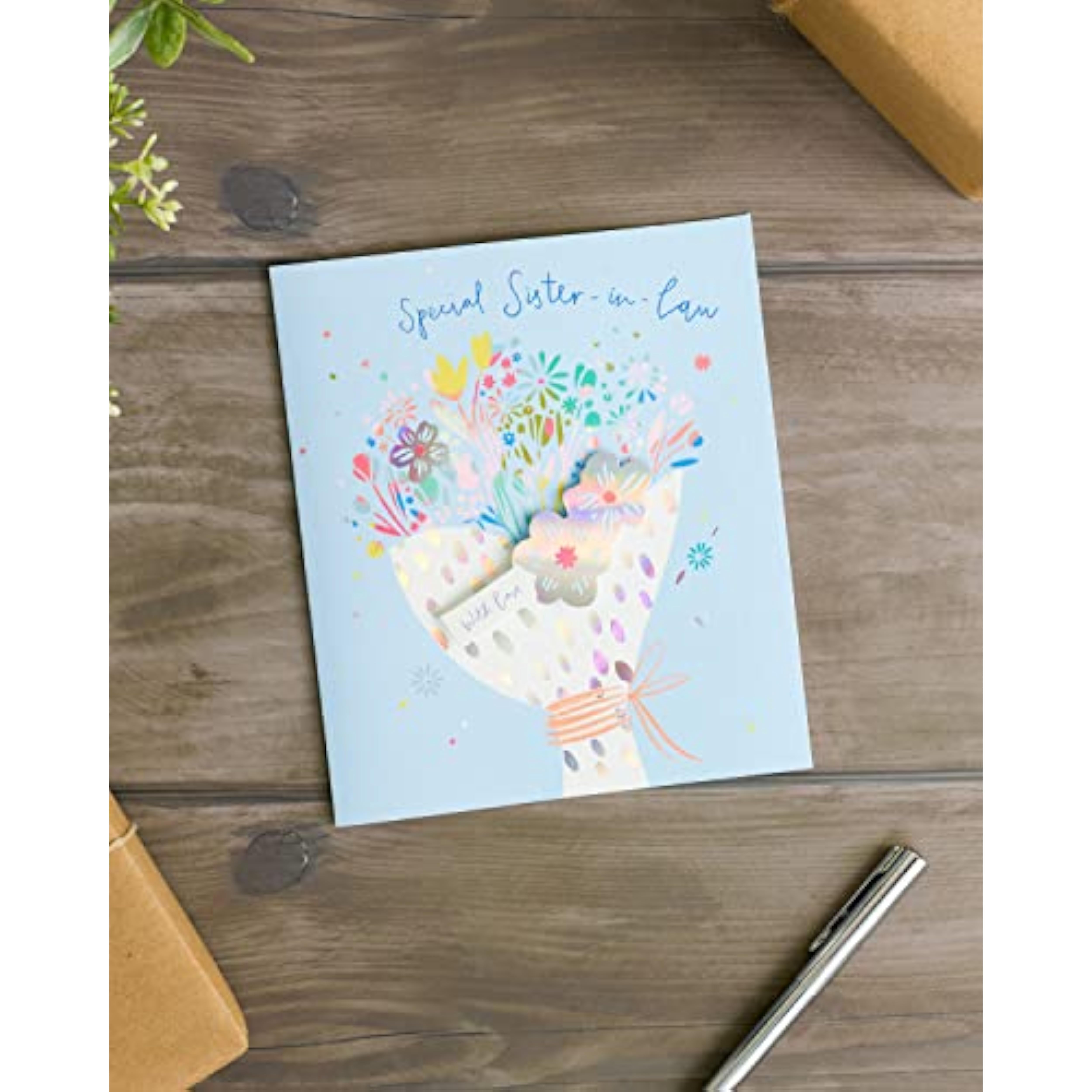 UK Greetings special design sister-in-law birthday card featuring colorful floral artwork and heartfelt message.