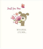 UK Greetings Lots of Woof greeting card featuring playful dog illustrations, perfect for sending cheerful messages.