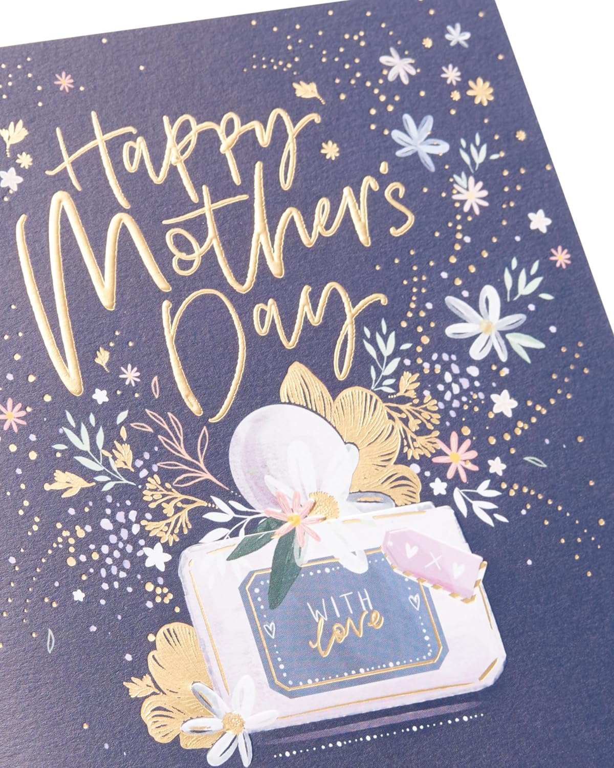 UK Greetings Mothers Day card featuring a stunning perfume design with elegant floral artwork and decorative elements.