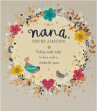 UK Greetings Sweet Design Nana birthday card featuring colorful floral and heart illustrations on a cheerful background.