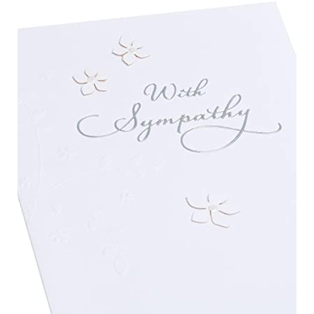 UK Greetings sympathy bereavement greeting card with white background, 2D flowers, pearl details, and silver foil lettering.