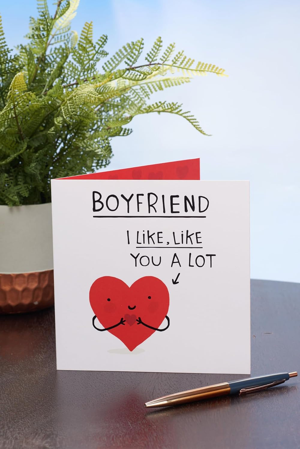 UK Greetings Valentine's Day card for boyfriend featuring a cute smiley heart design, perfect for expressing love and affection.