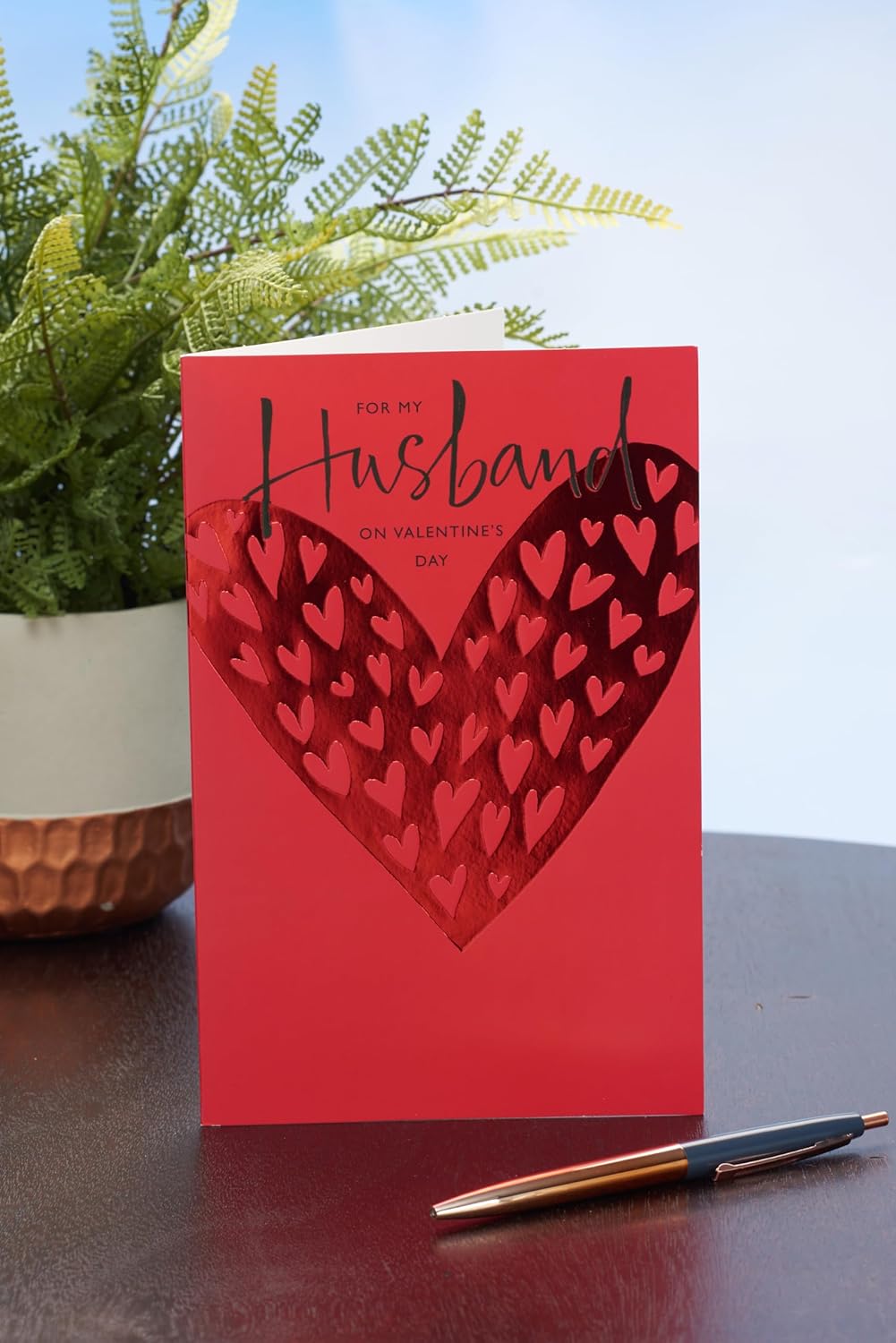 UK Greetings Valentine's Day card for husband featuring a bold red design, perfect for expressing love and affection.