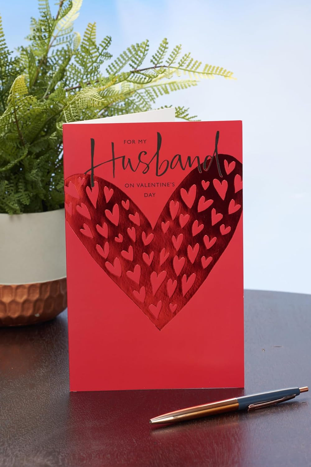UK Greetings Valentine's Day card for husband featuring a bold red design, perfect for expressing love and affection.
