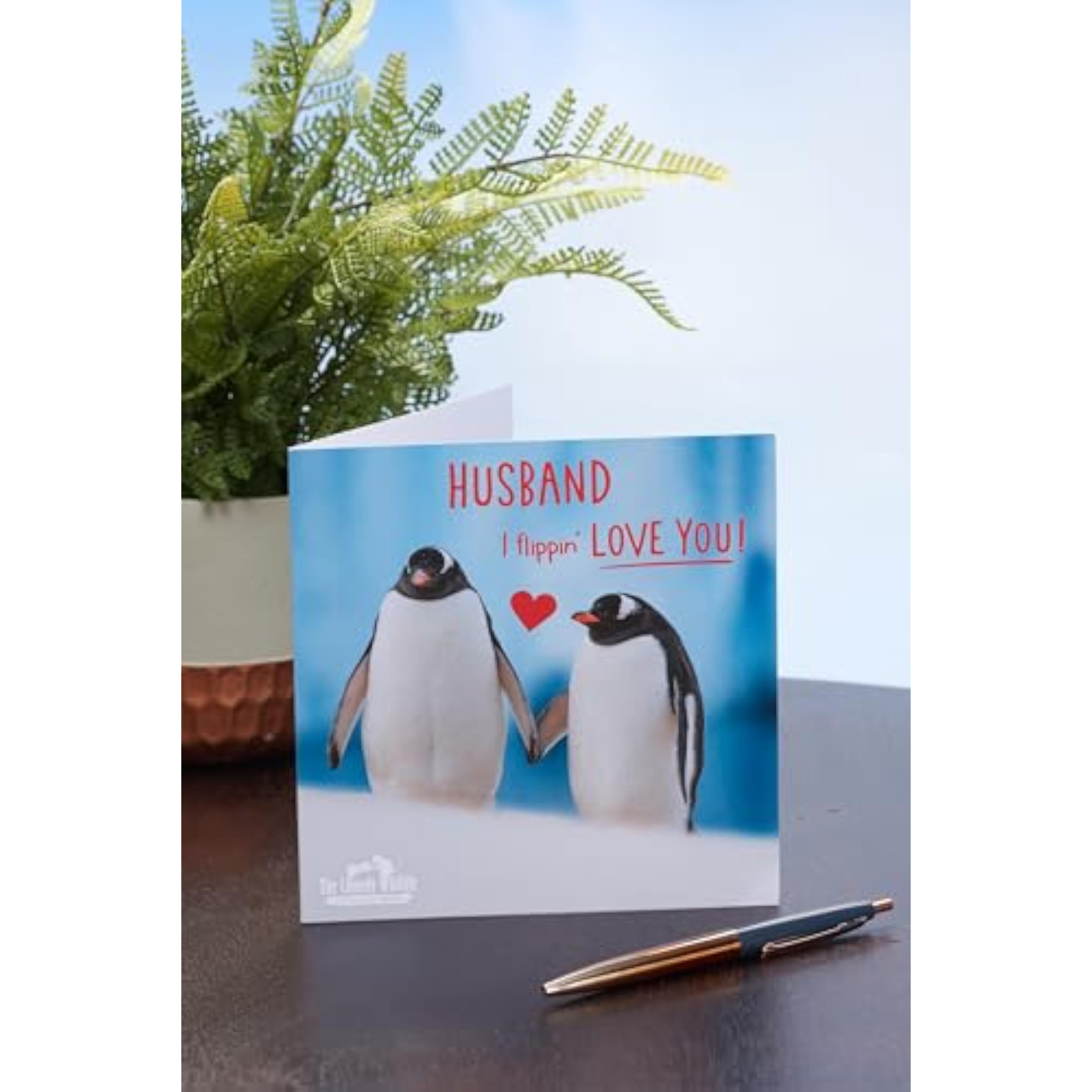 UK Greetings Valentine's Day card for husband featuring a cute penguin design, perfect for expressing love on special occasions.