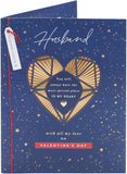 UK Greetings Valentine's Day card for husband featuring an intricate gold heart design on a greeting card.