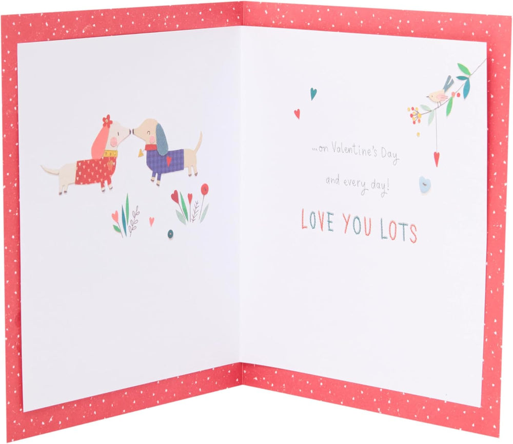 UK Greetings Valentine's Day card for husband featuring adorable dog illustrations and loving message in a charming design.