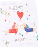 UK Greetings Valentine's Day card for husband featuring adorable dogs design, with heartfelt message and colorful illustration.