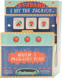 UK Greetings Valentine's Day card for husband featuring a pop-up jackpot slot machine design, with colorful and playful details.