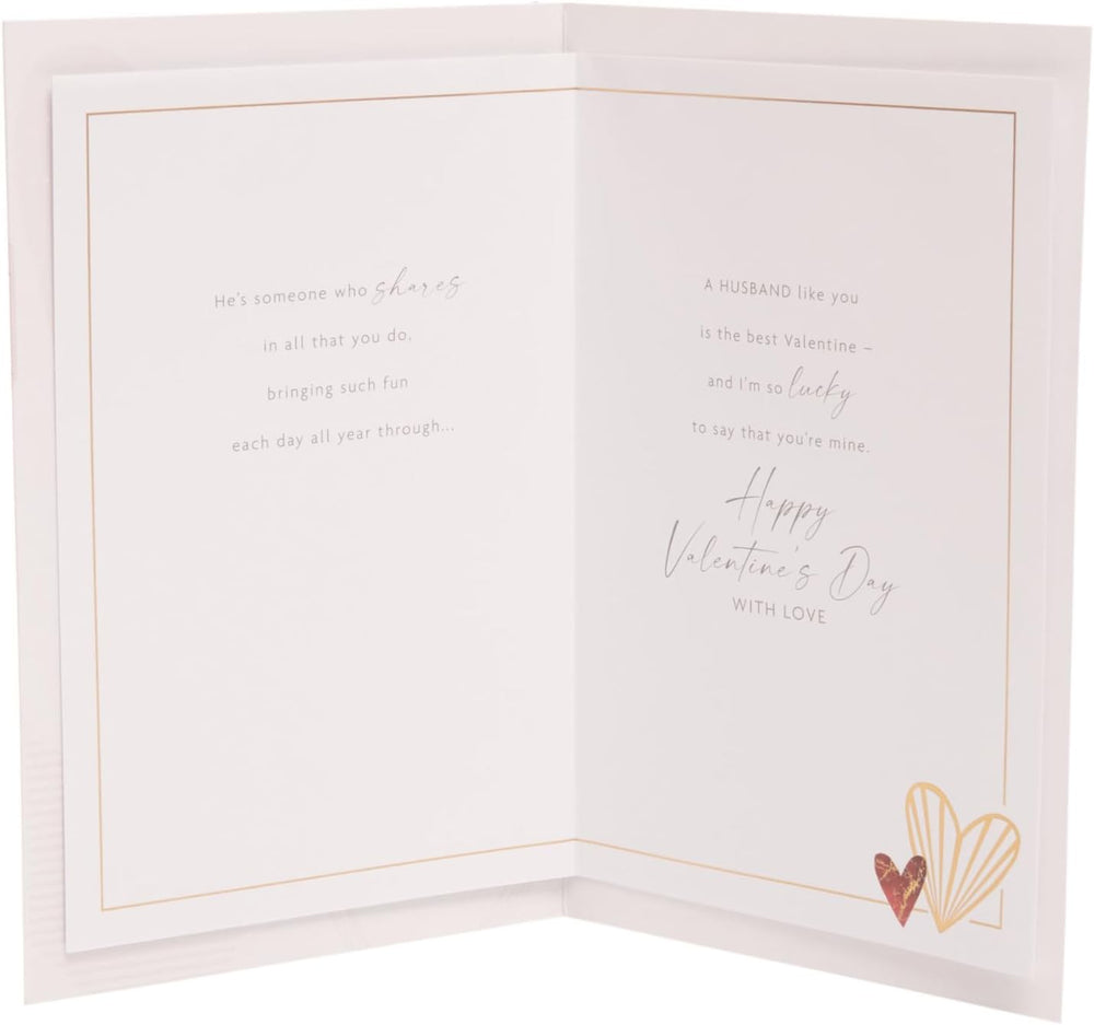 UK Greetings Valentine's Day Card for Husband featuring a heartfelt "What Is a Husband?" design, perfect for expressing love.