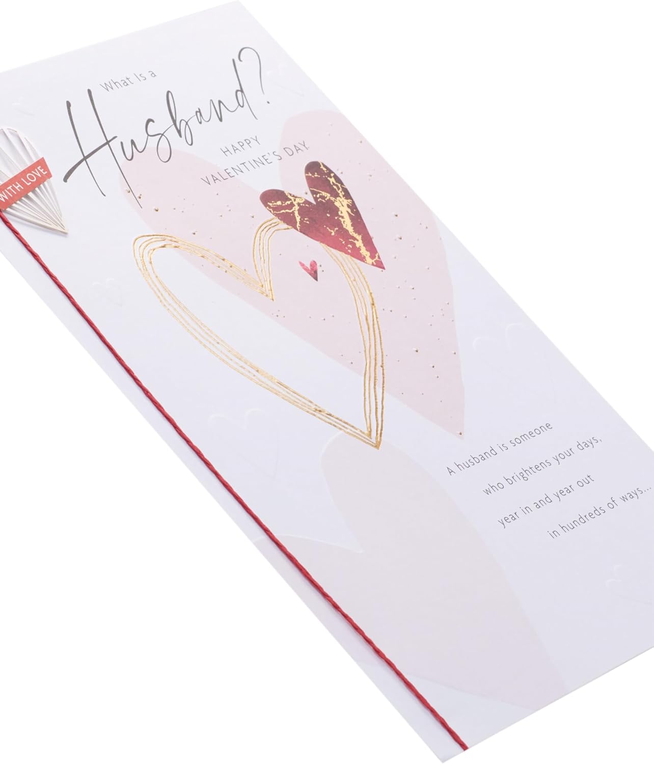 UK Greetings Valentine's Day card for husband featuring a "What Is a Husband?" design, with romantic illustrations on the front.