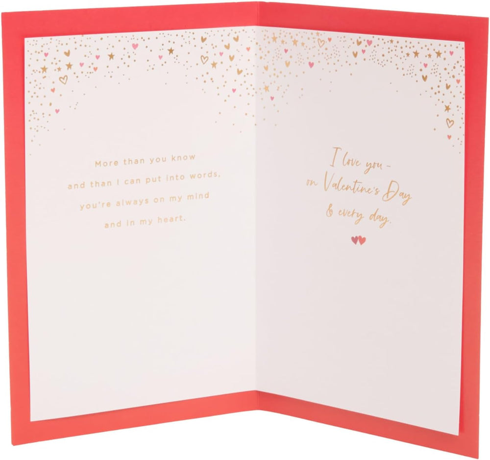 UK Greetings Valentine's Day card for partner featuring a champagne design, romantic greeting card for special occasions.
