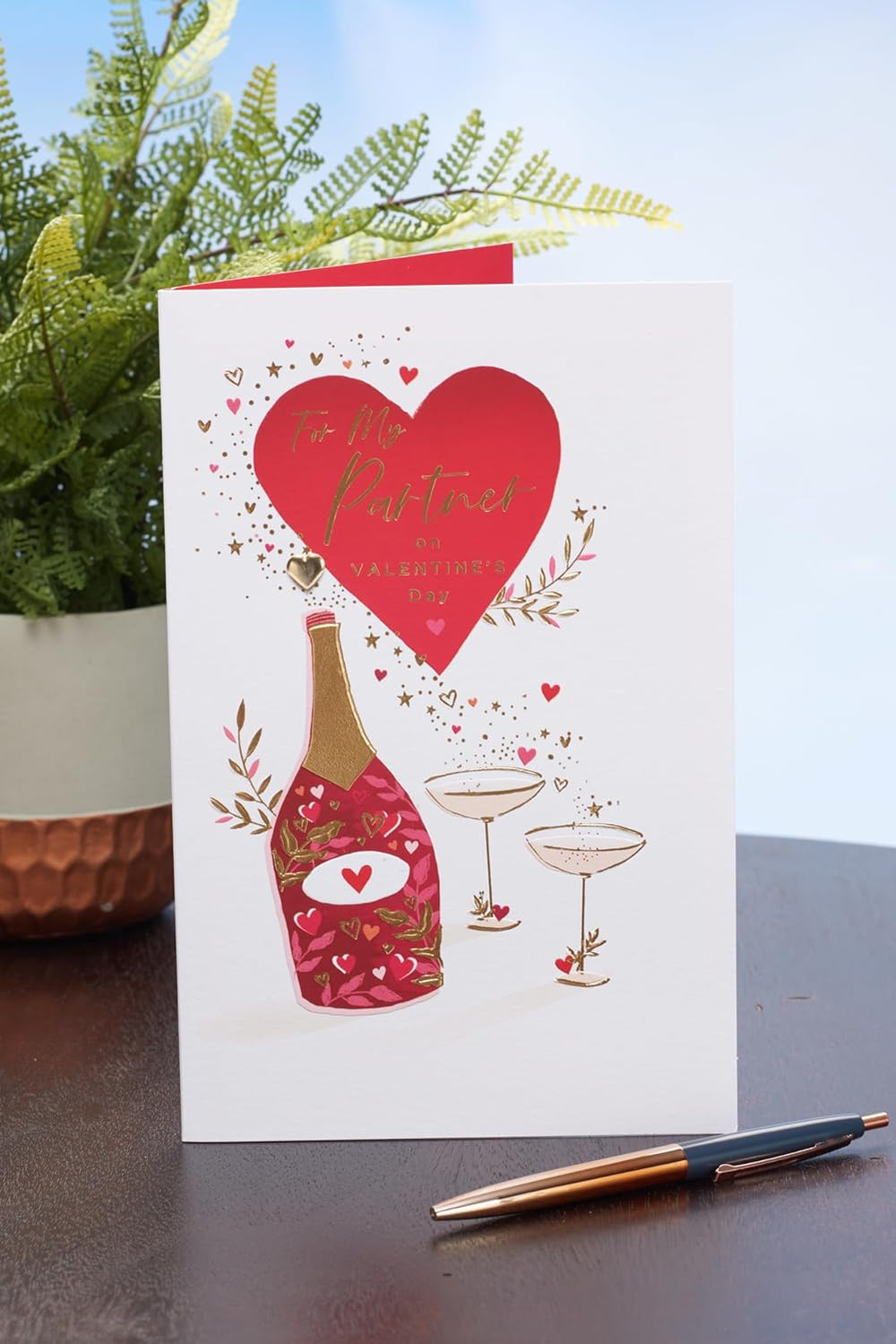 UK Greetings Valentine's Day card for partner featuring a champagne design, perfect for expressing love and celebration.