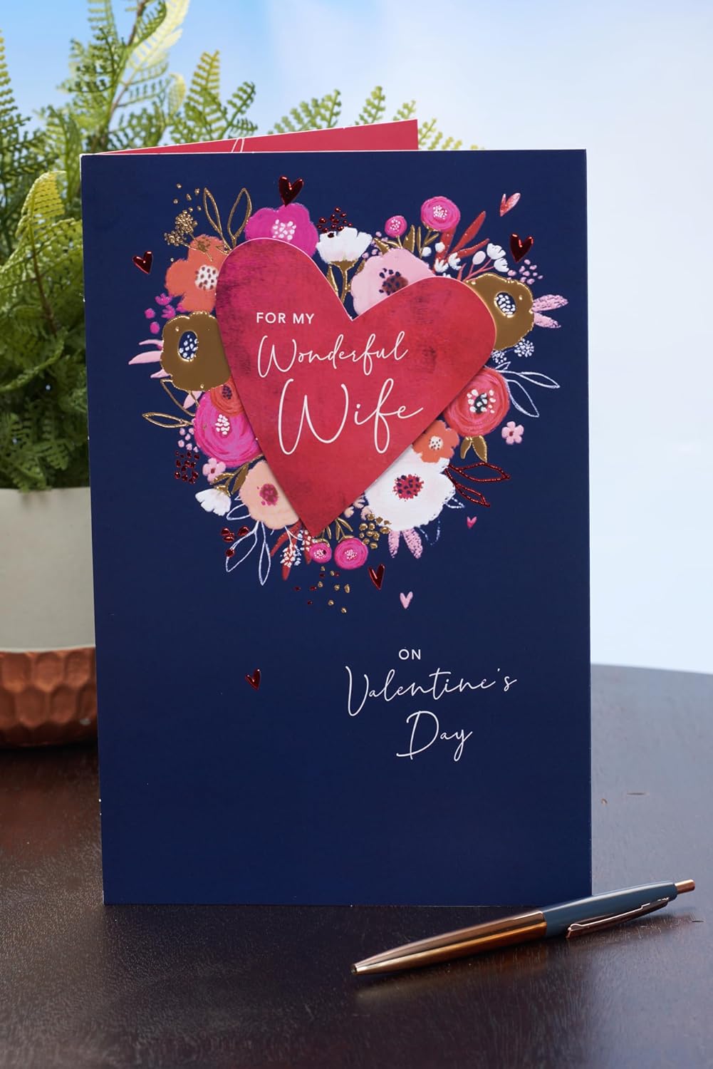 UK Greetings Valentine's Day card for wife featuring a floral heart design, perfect for expressing love on special occasions.