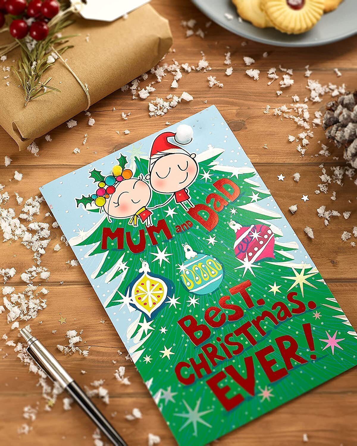 UK Greetings Wig Wam Mum and Dad Christmas Card featuring festive design and holiday message for parents.