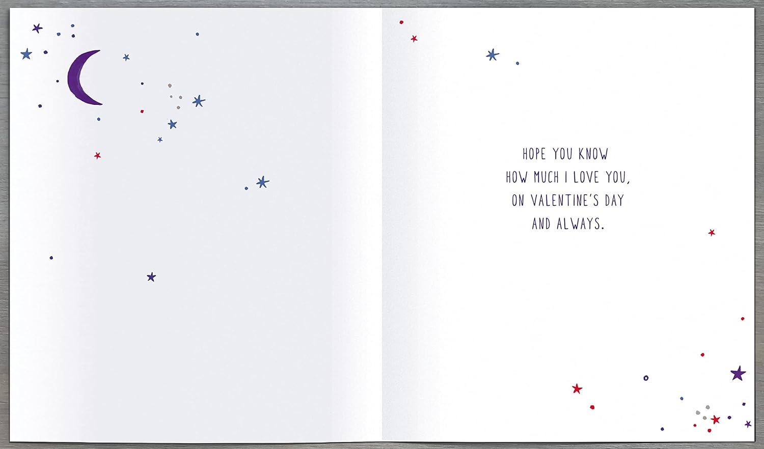 UK Greetings Valentine's Day card featuring sun, moon, and stars design, expressing love and affection in a colorful greeting card.