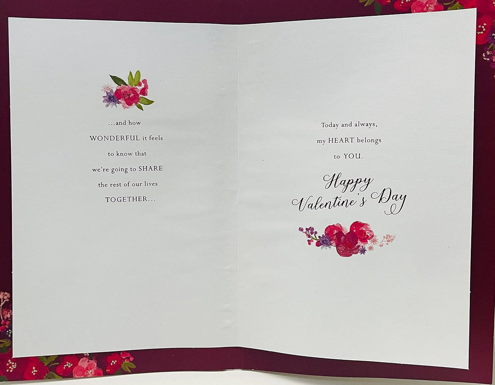 Valentine's Day greeting card by UK Greetings featuring a red dress, roses, 3D embellishments, sequins, glitter, and heartfelt verse.
