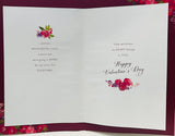 Valentine's Day greeting card by UK Greetings featuring a red dress, roses, 3D embellishments, sequins, glitter, and heartfelt verse.