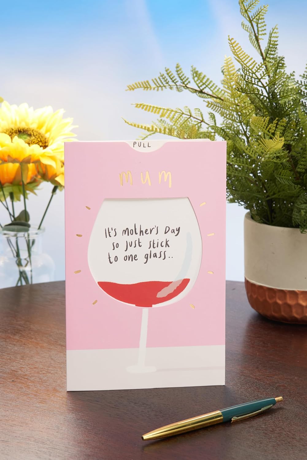 UK Greetings Mother's Day Card for Mum featuring an interactive wine glass design, perfect for celebrating moms.