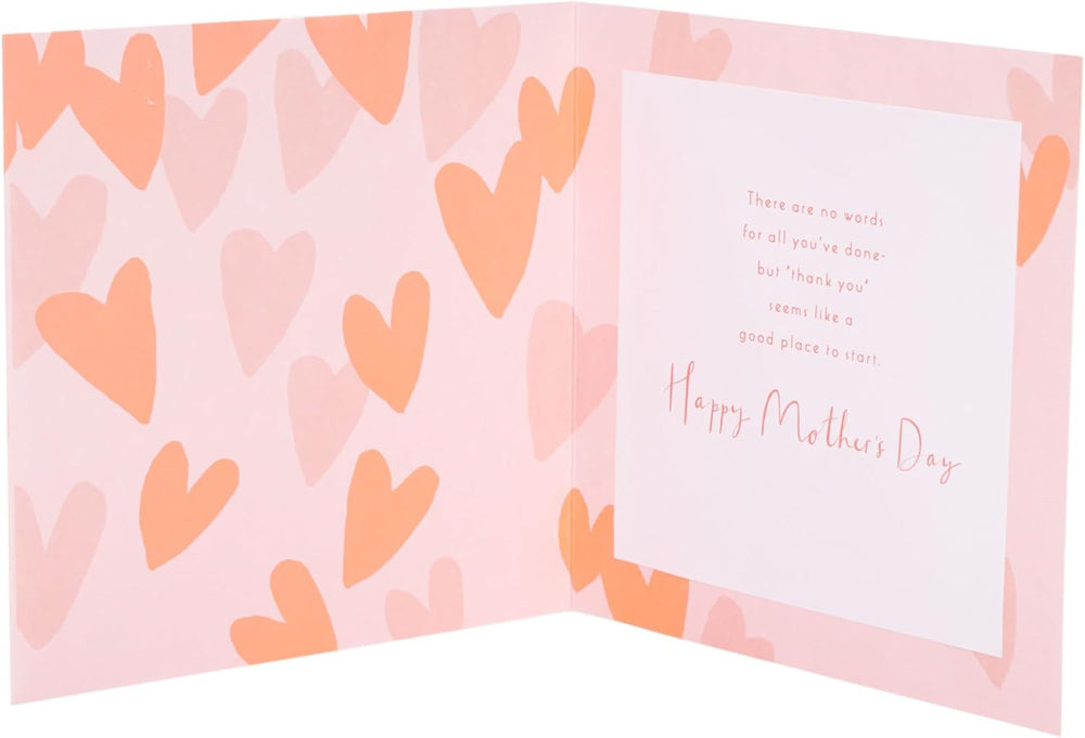 UK Greetings Mother’s Day Card for Mum with keepsake heart attachment, featuring a heartfelt design for Mother's Day celebrations.