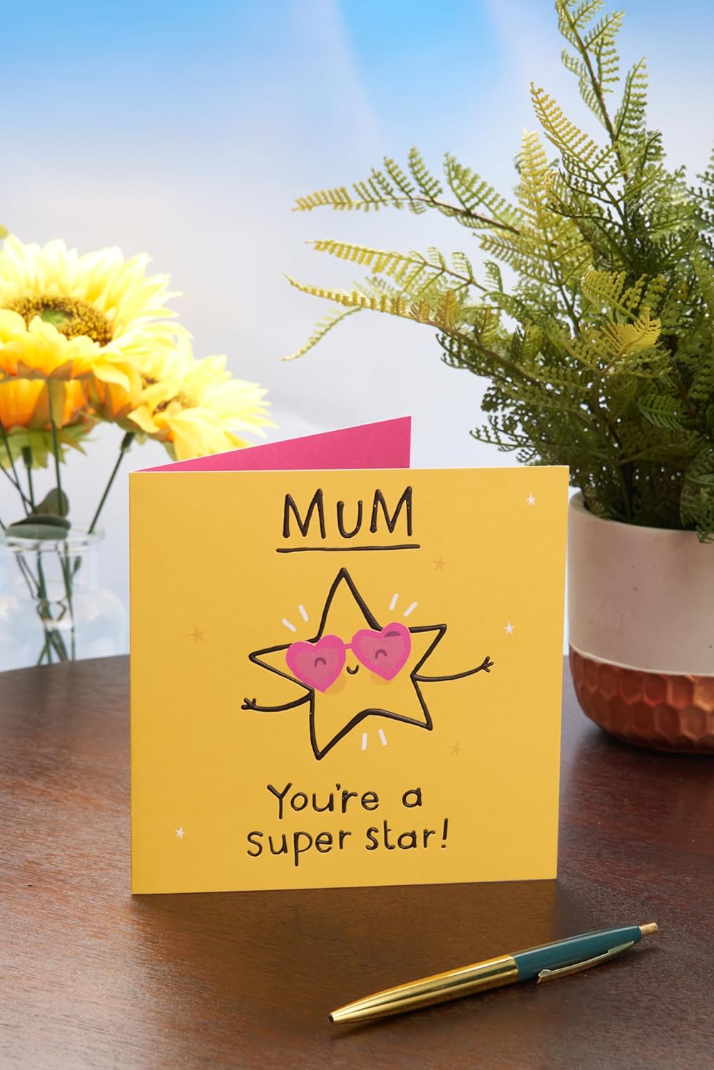 UK Greetings Mother's Day Card for Mum featuring a "You're a Super Star" design with colorful, cheerful illustrations.