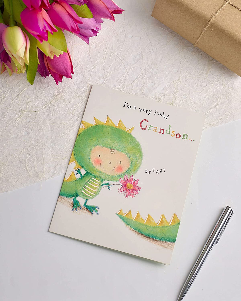 UK Greetings Mother's Day card featuring a sweet dinosaur design from grandson, perfect for expressing love to mom.