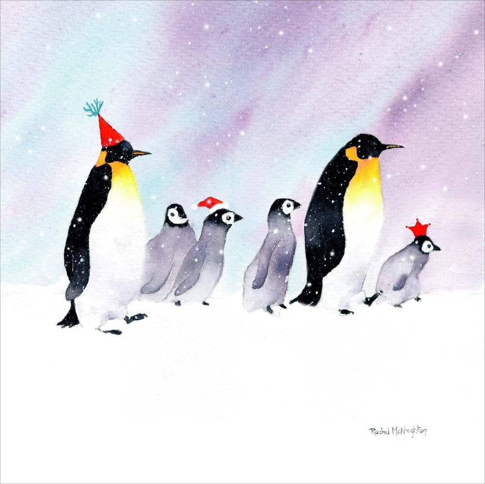 UK Greetings Christmas Penguins on a Mission Christmas card featuring festive penguins on decorated stationery for the holiday season