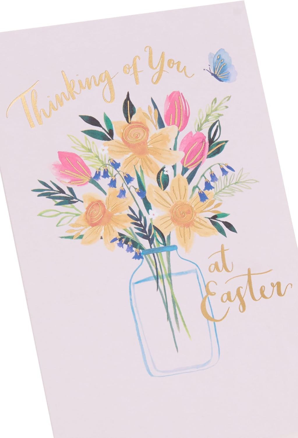 UK Greetings Easter card featuring daffodils in a vase with a "Thinking of You" message on floral stationery design.