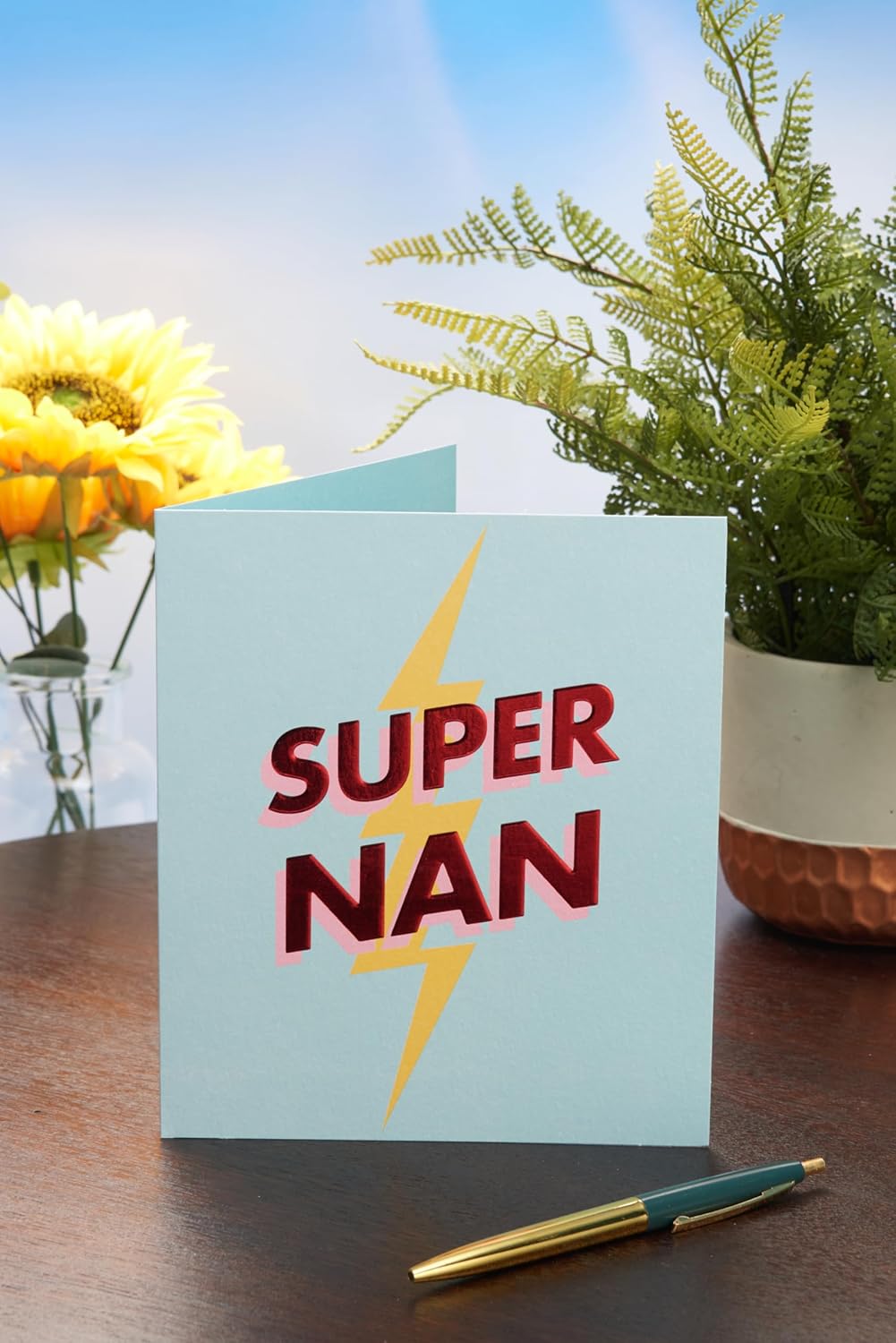 UK Greetings Mother's Day card for Nan featuring a Super Nan design, showcasing colorful floral illustrations and heartfelt message.