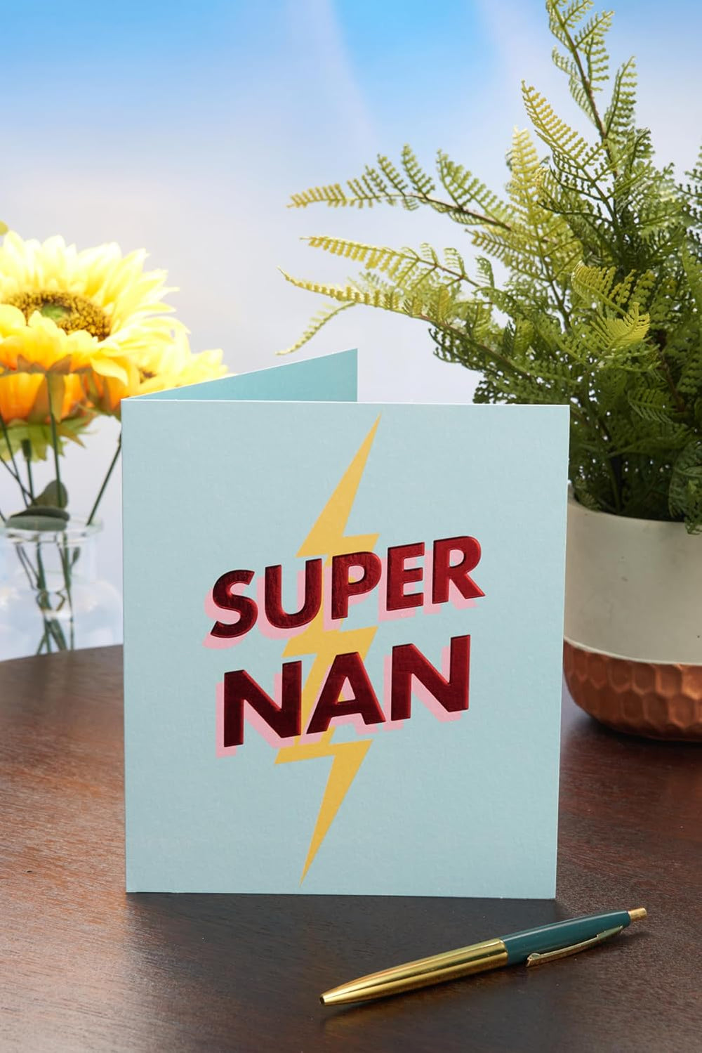 UK Greetings Mother's Day card for Nan featuring a Super Nan design, showcasing colorful floral illustrations and heartfelt message.
