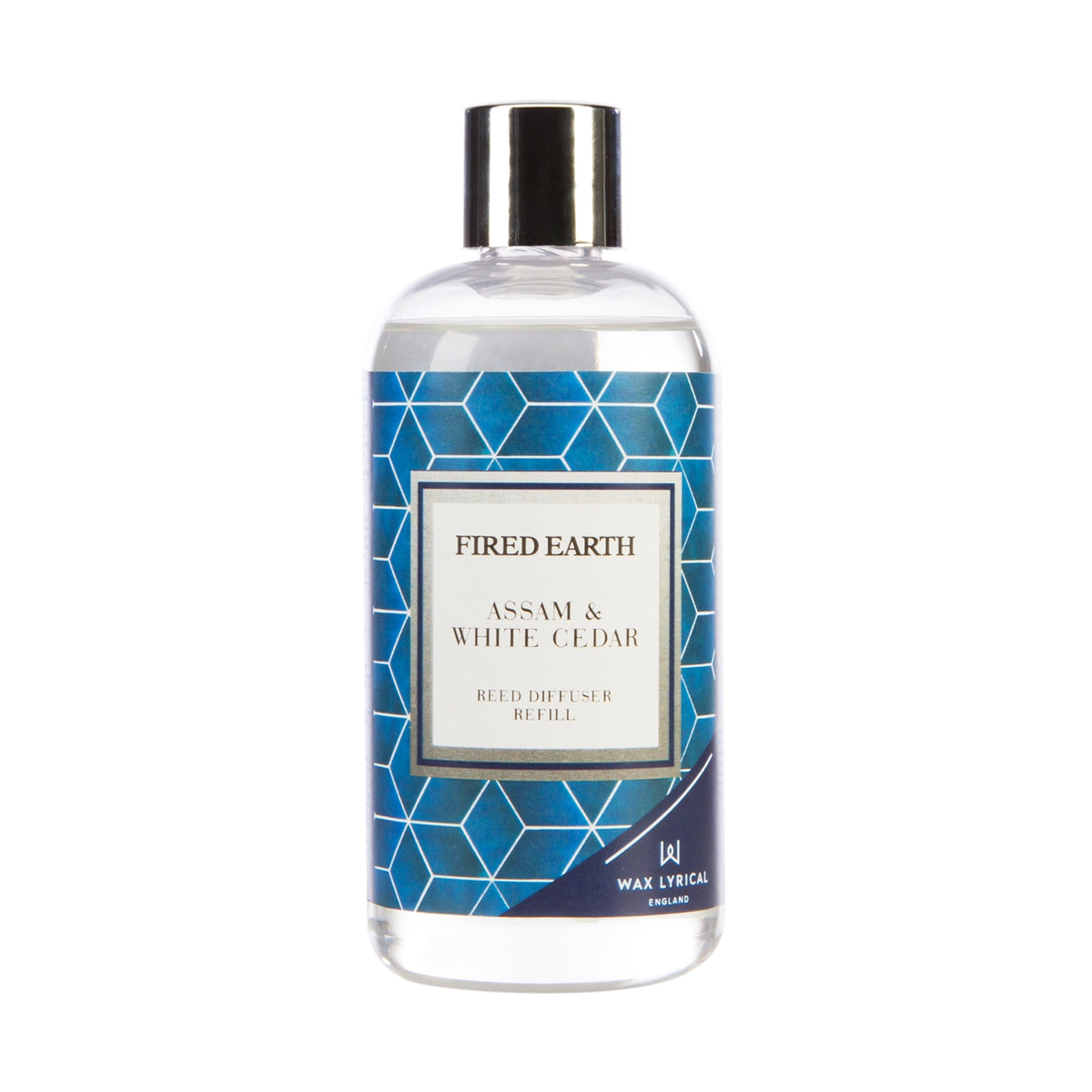 Wax Lyrical Assam & White Cedar home fragrance in a decorative jar with fresh cedar and warm, woody scent elements.