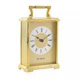 Widdop & Co gilt carriage clock with brass finish and classic design, showcasing a vintage timepiece on a decorative base.