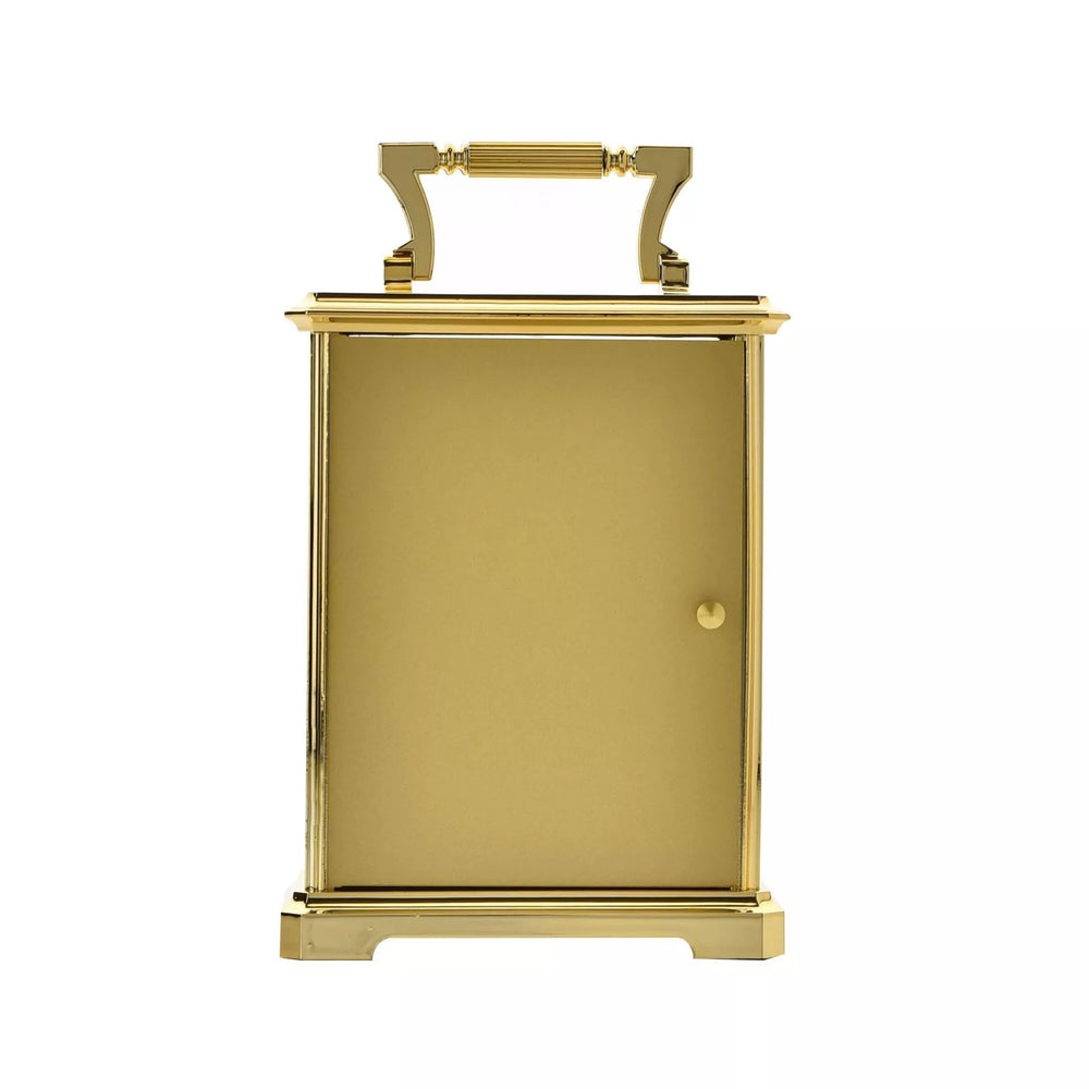 Widdop & Co gilt carriage clock with ornate design and classic timepiece features, displayed on a polished surface.