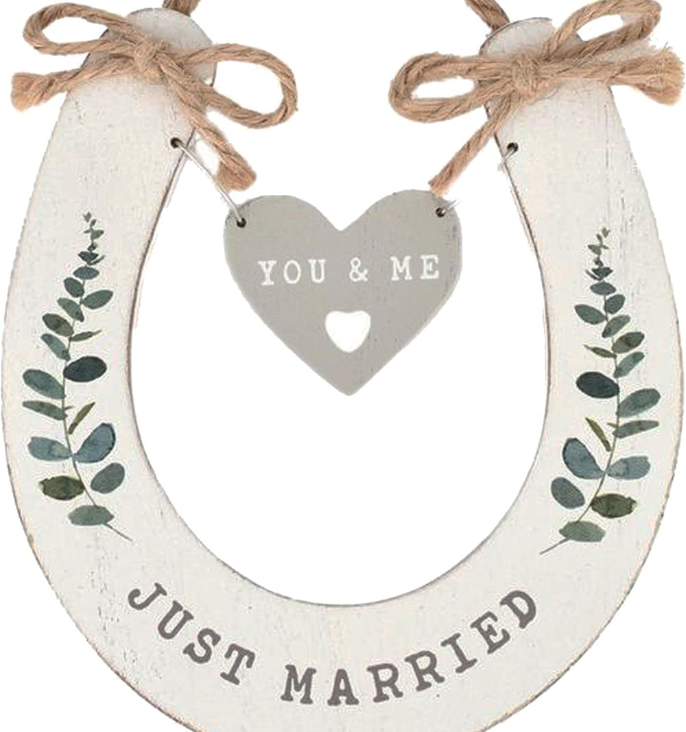 White wedding horseshoe with hanging heart giftware by Widdop & Co, featuring "Just Married" for wedding celebrations.